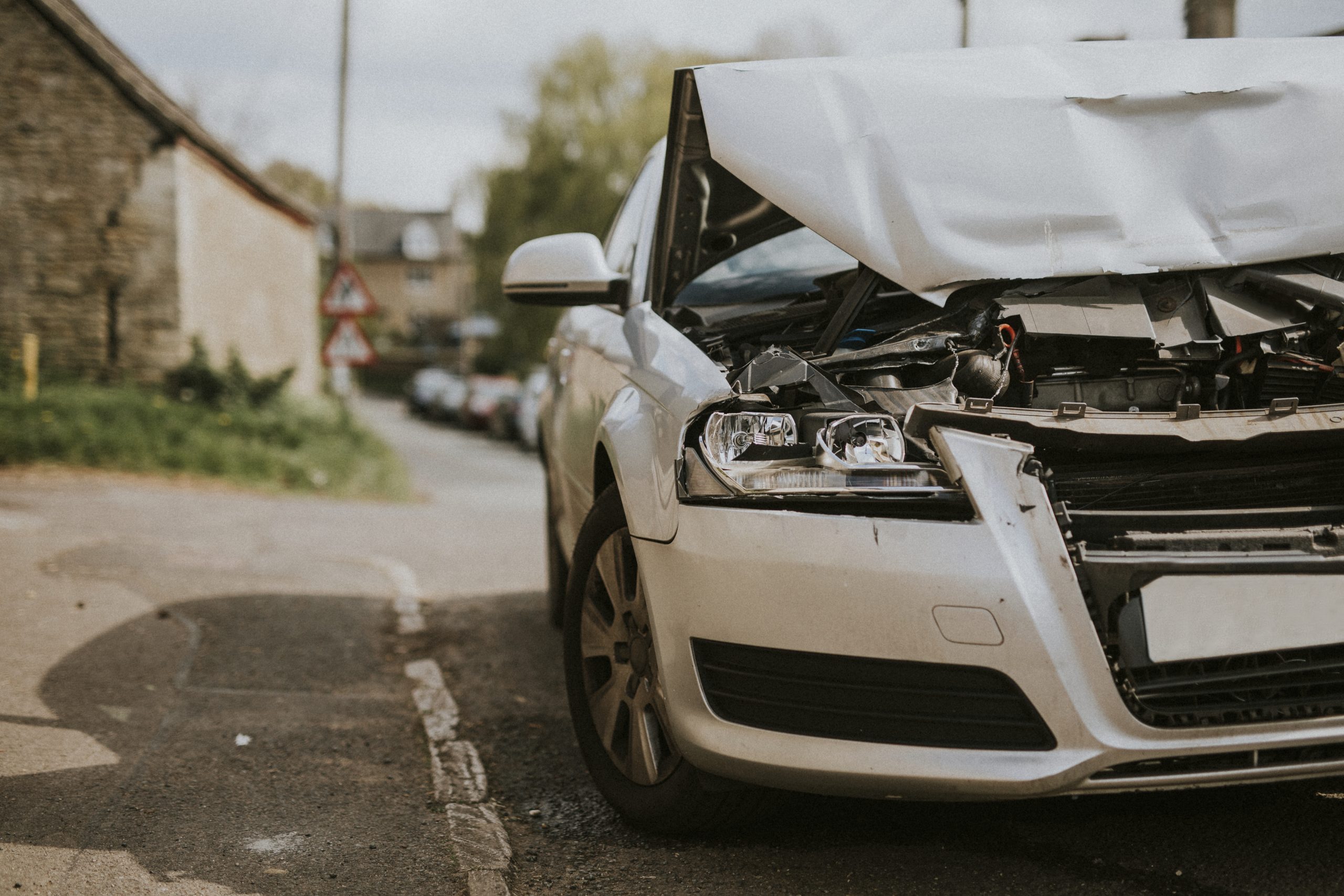 wrecked car parked on the street after a car crash 2021 09 04 03 10 29 utc