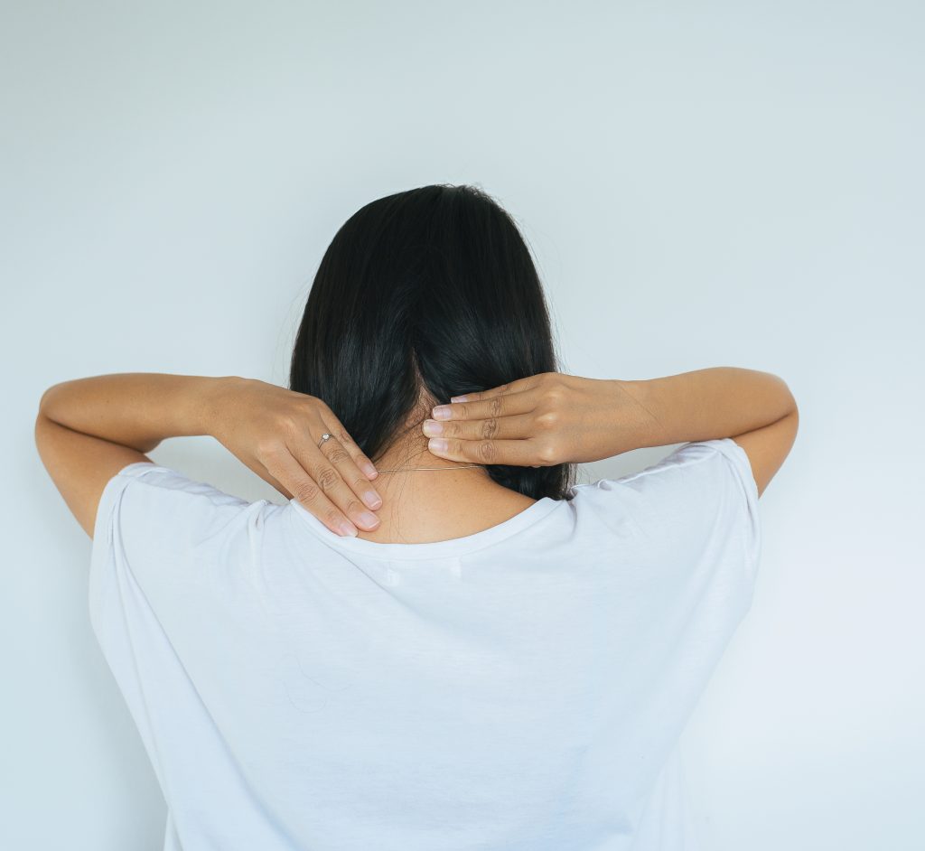 woman with pain in the neck female hand touching a 2021 10 12 13 53 11 utc 2